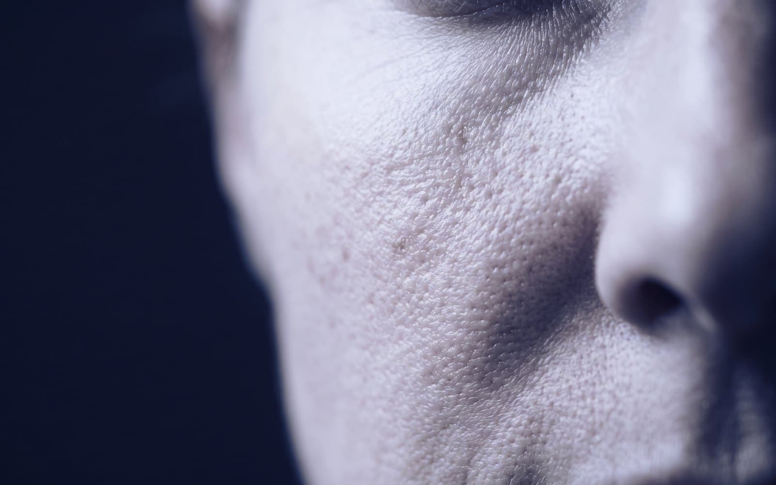 Close-up of bare skin on the cheek showing natural texture